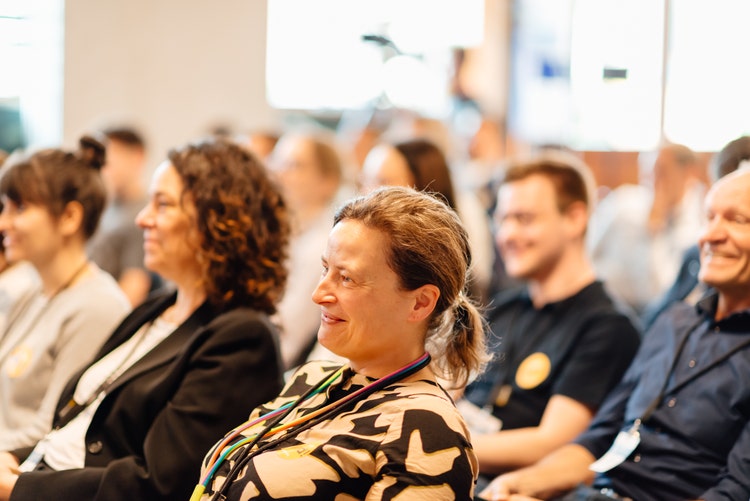 audience listening and smiling